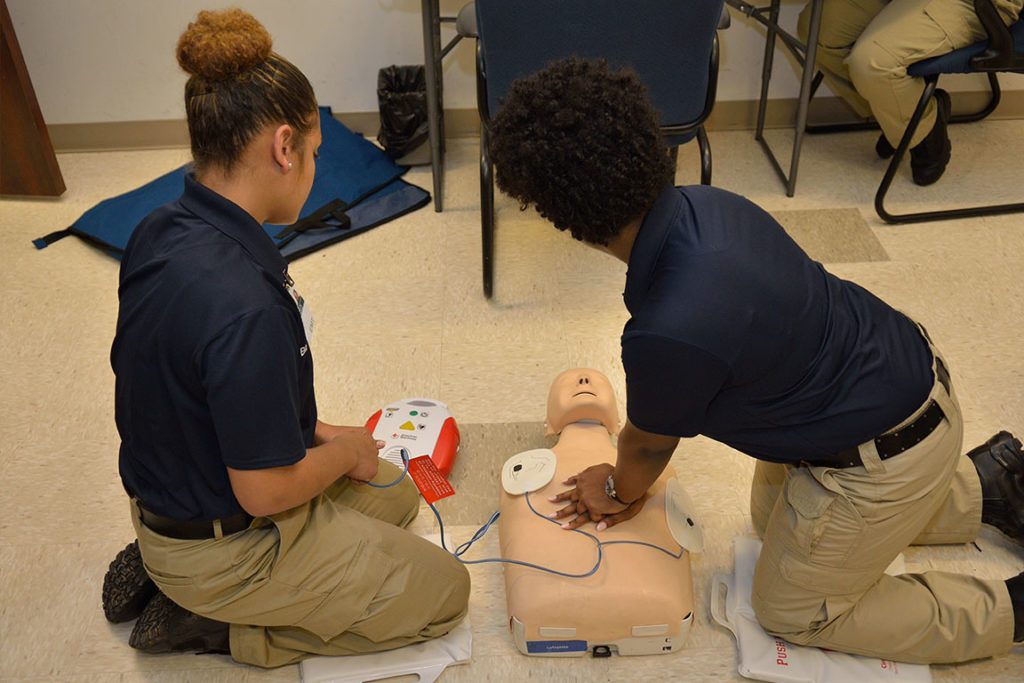 student cpr learning in classroom
